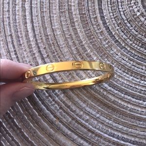 Gold bracelet resembles a love bracelet